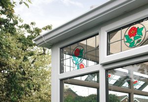 White uPVC conservatory with stained glass