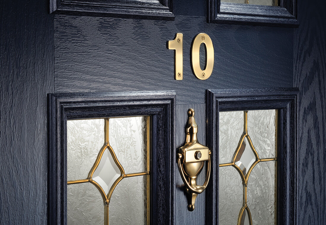Dark blue composite door with gold hardware