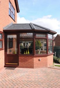 Rosewood Victorian conservatory with a tiled roof