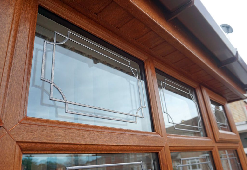 Golden oak effect uPVC casement window close up