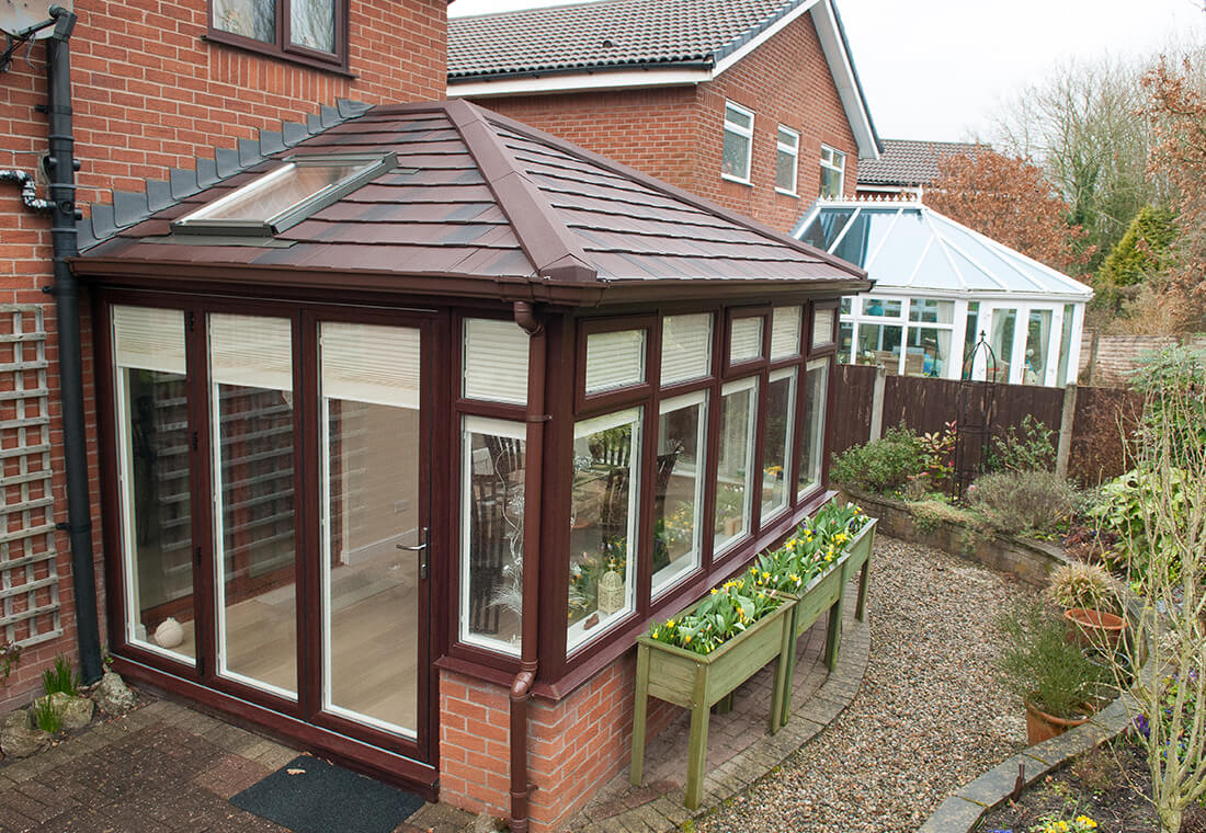 Rosewood uPVC conservatory with a tiled roof