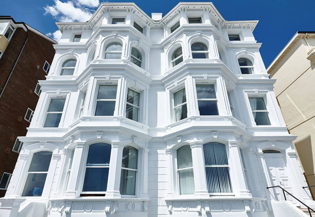 White uPVC bay vertical sliding windows