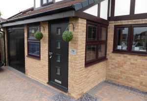 Black composite door and rosewood windows