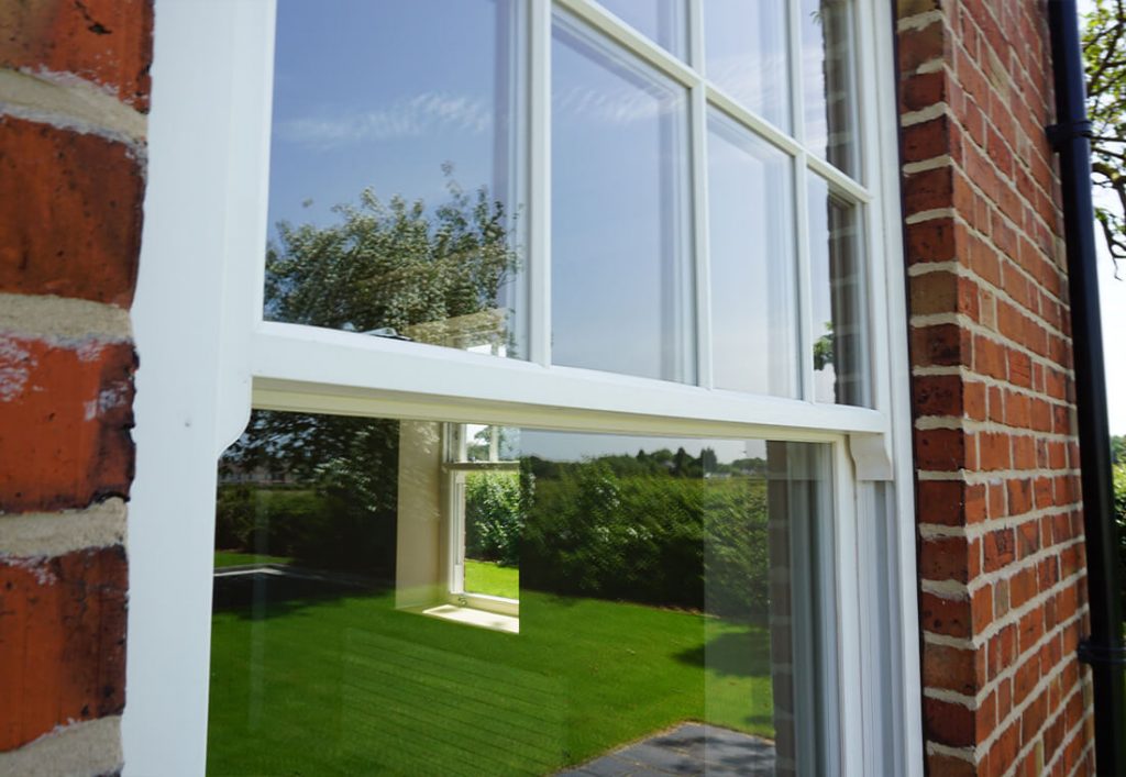 white timber effect sliding sash window