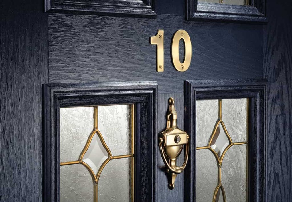 Dark blue composite door with gold hardware